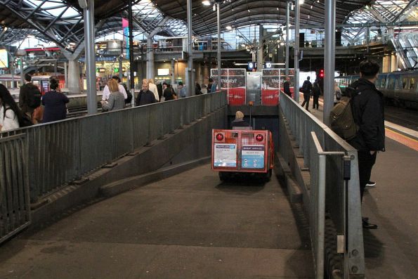 Travellers Aid buggy heads into the subway from platform 9 and 10