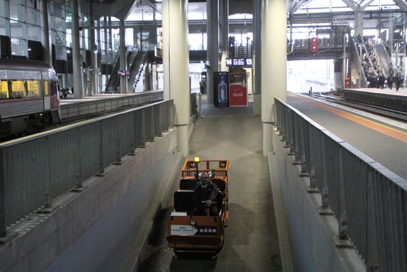 Travellers Aid buggy heads into the subway from platform 13 and 14