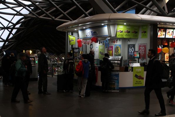 Tatts outlet on the Collins Street concourse covered with Myki posters