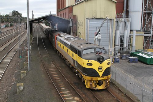 S317 and S302 push the consist out of the mill siding at Kensington