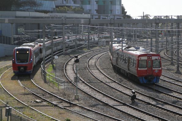 A-City 4018 stabled outside Adelaide station, with 3021 and classmate passing on a Belair service