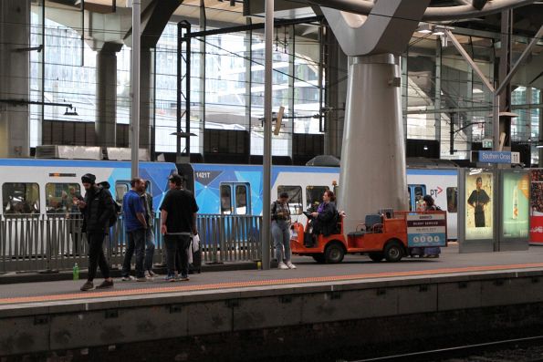 Travellers Aid buggy heads down into the subway