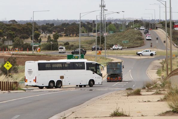 Road coach departs Caroline Springs station with a Ballarat line rail replacement service