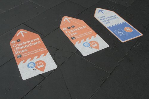 Directions to Frankston, Cranbourne and Pakenham line buses on the footpath outside Flinders Street Station