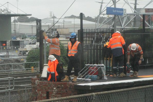 Installing new metal picket fencing at South Kensington platform 2