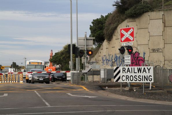 Transit Systems bus #50 5993AO on route 427 waiting at the Fitzgerald Road level crossing at Ardeer