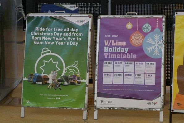 'Ride for free Christmas Day and New Years Eve' and 'V/Line Holiday Timetable' posters at Sunshine station