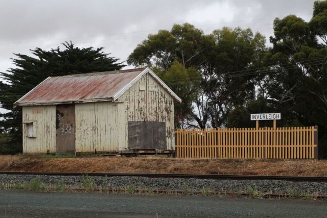 Fencing and station sign added to the platform mound