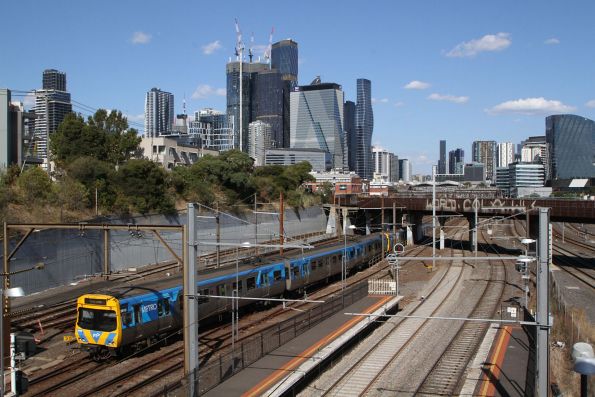 EDI Comeng 381M trails an up service into the City Loop at North Melbourne