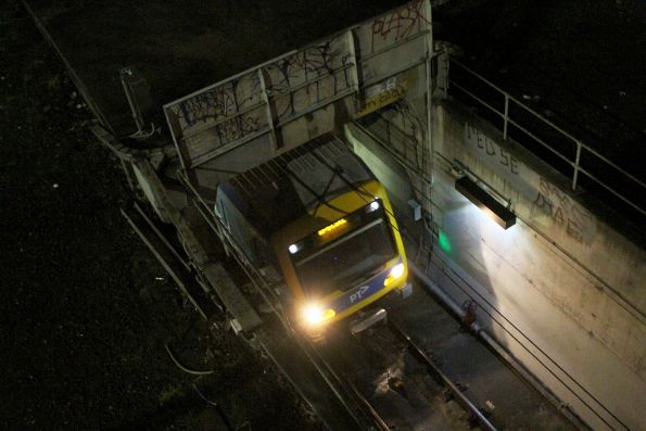 X'Trapolis train emerges from the City Circle Loop portal beneath the Exhibition Street bridge