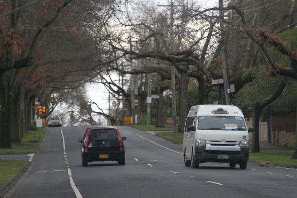 Maxi taxi for the route 766 shuttle bus back to to Box Hill heads along Mont Albert Road, Mont Albert