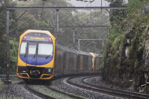 Oscar set H9 trailing out of the Bald Hill Tunnel with a down Kiama service