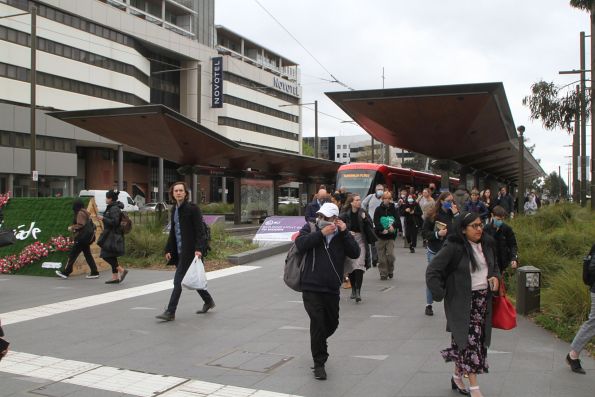 Passengers exit LRV #013 at the Alinga Street terminus