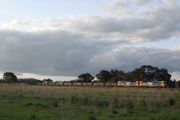 8166 leads 8132 towards Cootamundra West on an up containerised ore train from Goonumbla to Port Kembla