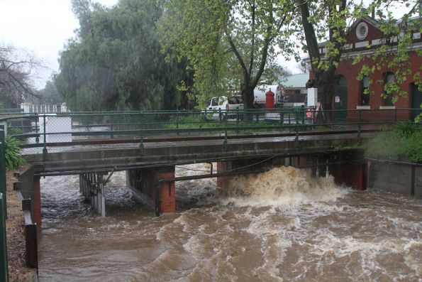 Back Creek full of flood water alongside the depot 