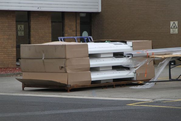 Three bus air conditioning modules still in their cardboard boxes