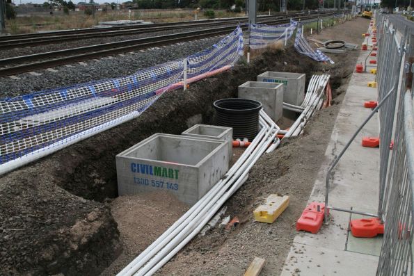 Installing new signalling and power conduit beside the standard gauge line on Harvester Road at Sunshine