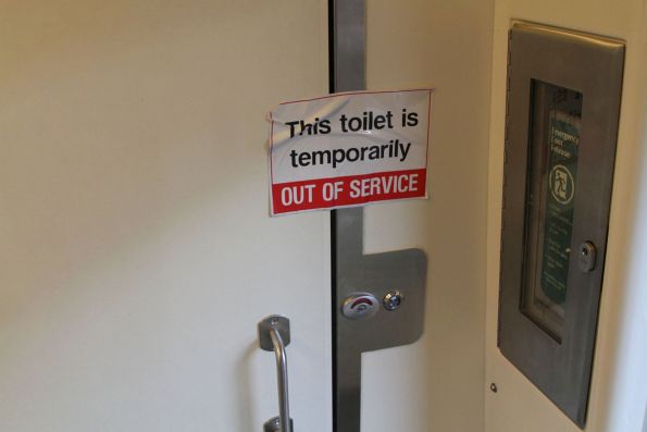 'This toilet is temporarily out of service' notice onboard a VLocity carriage