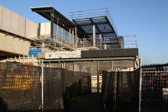 Temporary walkway through the construction site to give access to the incomplete Parkiteer cage