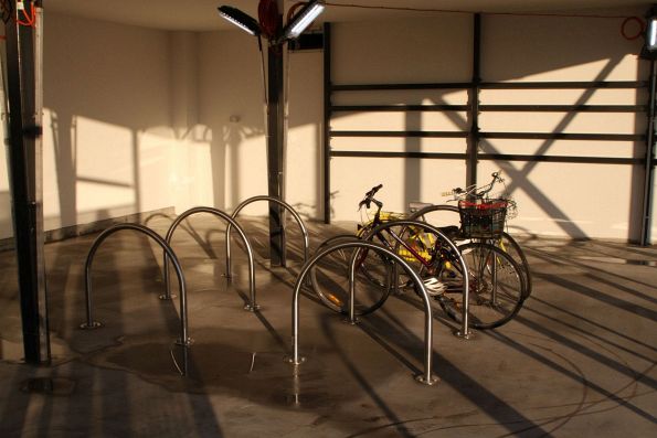 Bikes locked up in the unfinished Parkiteer cage at the new Deer Park station