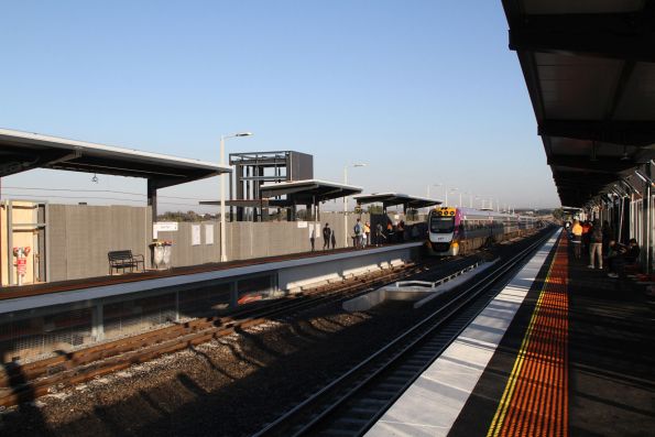 VLocity VL103 and VL23 pause at the new elevated Deer Park station on the down