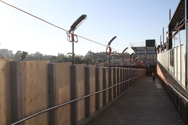 Temporary lighting along the permanent ramp to platform 1