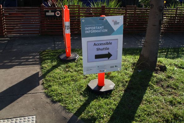 'Accessible shuttle' direction signage outside the new station