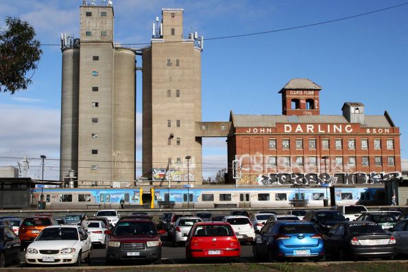 EDI Comeng 44M and 518M pass the John Darling flour mill at Albion