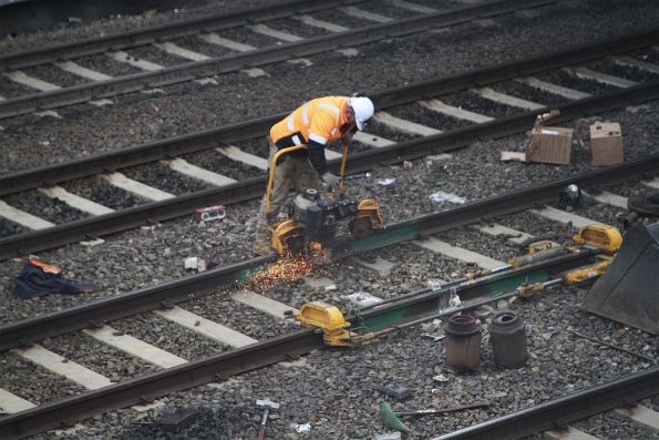 Track gang grind down a rail weld at the up end of West Footscray