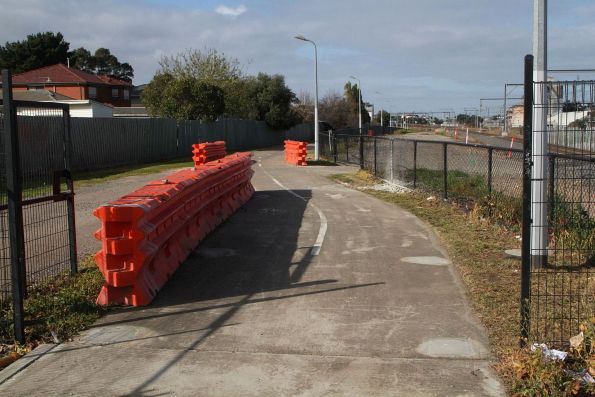 Crash barriers cover areas of the Sunshine-Tottenham shared path surface destroyed by Melbourne Airport Rail works