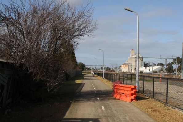 Crash barriers cover areas of the Sunshine-Tottenham shared path surface destroyed by Melbourne Airport Rail works