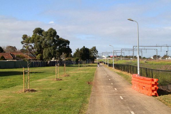 Crash barriers beside the Sunshine-Tottenham shared path cover a muddy bog created by Melbourne Airport Rail workers