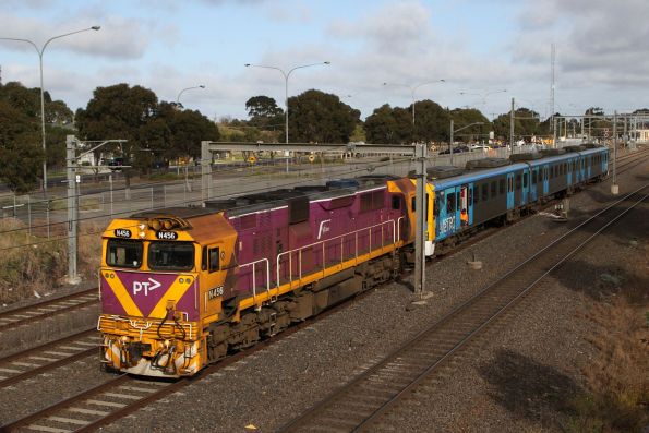 N456 departs Laverton with a disabled Siemens set led by 768M