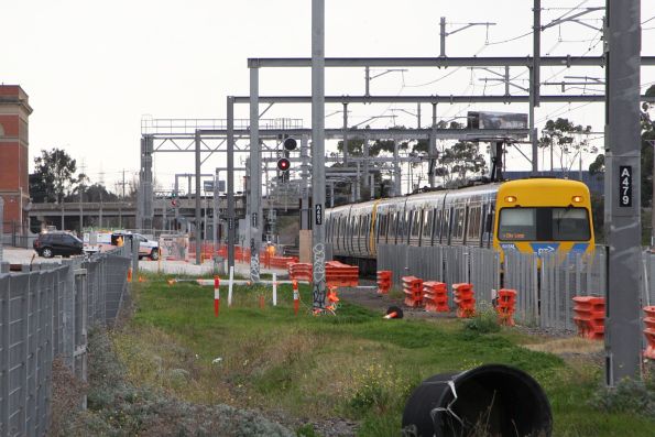 Alstom Comeng 643M trailing a down train stopped at Albion at the failed signal