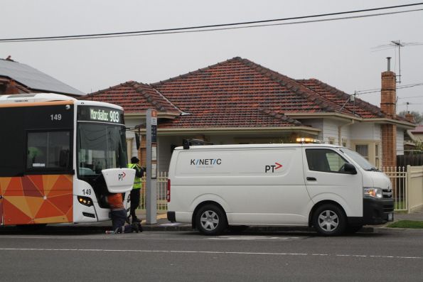 Mechanic works on broken down Kinetic bus #149 BS03LH on Hampshire Road, Sunshine