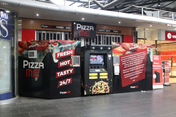 Hot pizza vending machine installed in front of an abandoned health food shop at Southern Cross Station