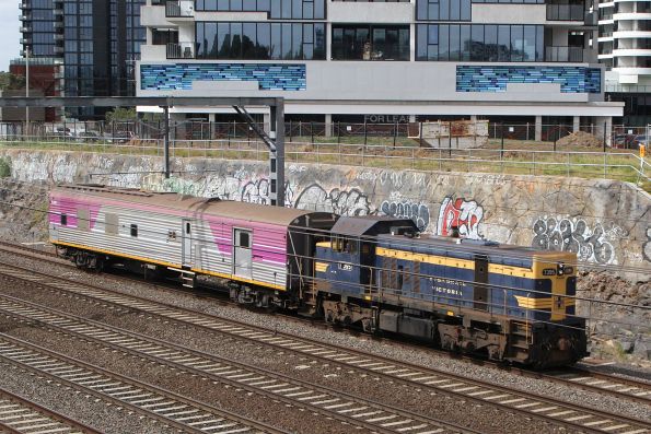 T395 leads retired V/Line power van PCJ491 through Footscray bound for Newport Workshops