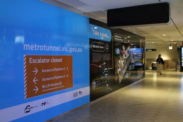 'Building the new State Library Station' signage on the hoardings at the west end of Melbourne Central station where a second escalator is being added to the existing shaft towards platform 1 and 2