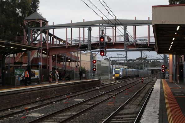 Small group of railfans on the platform at Sunbury capture HCMT set 37 exiting the sidings to form the first public HCMT service on the Sunbury line