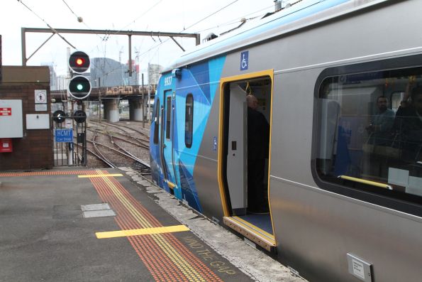 HCMT set 37 stops for passengers at the end of North Melbourne platform 3, headed for Flinders Street