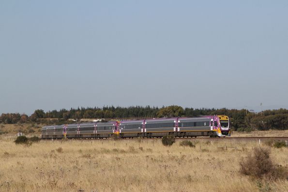 VLocity VL74 leads VL21 and VL57 on a 9-car down Wyndham Vale service at Ravenhall