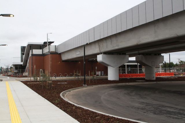 Bus loop runs beneath the viaduct at the up end of the station