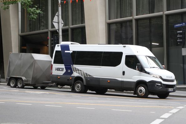 HG Corporate Buses minibus XV95BF with luggage trailer at William Street and Flinders Lane