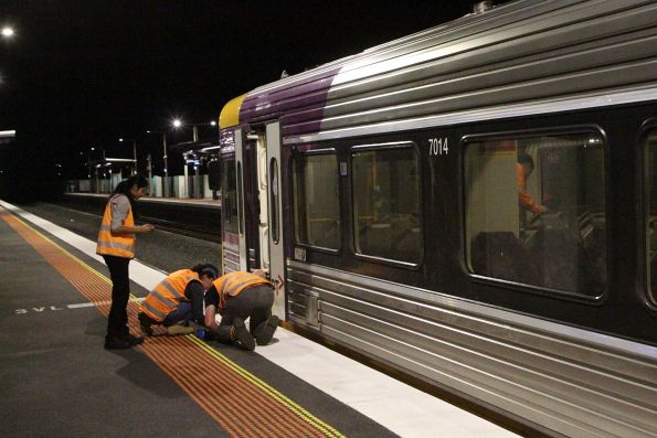 Engineers check the clearances between the modified plug doors fitted to Sprinter 7014 and the raised platform at Deer Park