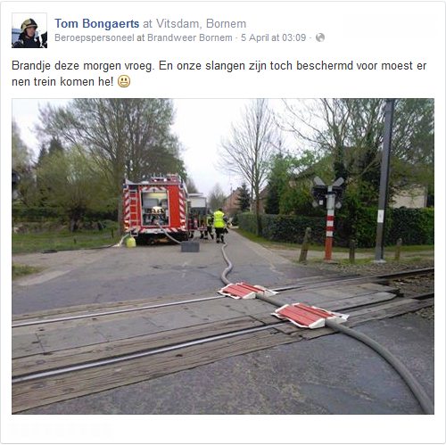 Fire hose over railway tracks (by Tom Bongaerts)