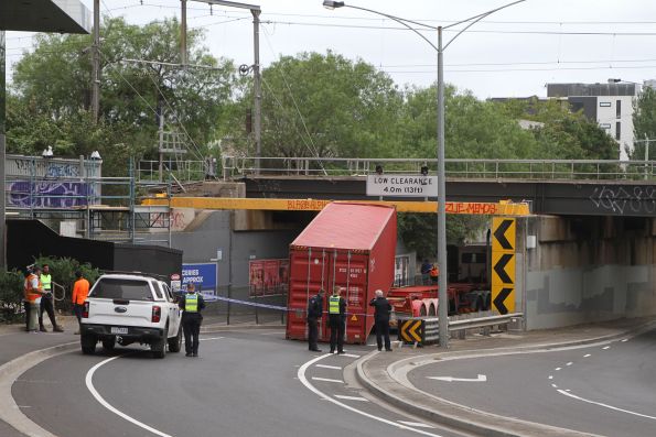 Victoria Police in attendance at Napier Street after the driver of a eastbound container truck struck the bridge