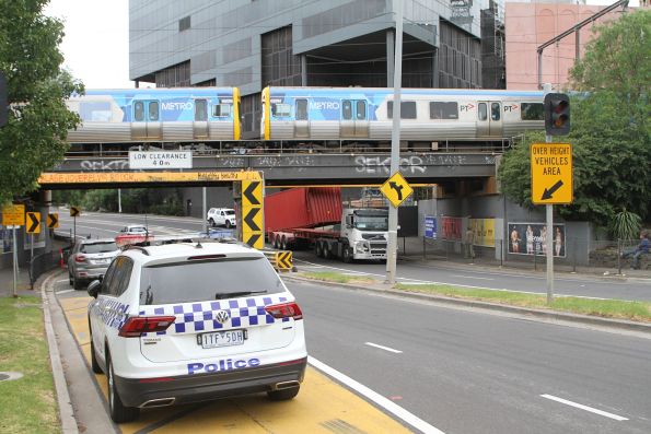 Victoria Police in attendance at Napier Street after the driver of a eastbound container truck struck the bridge