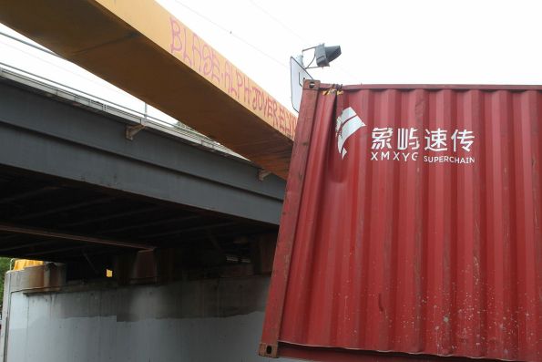 40 foot container bashed up after it hit the Napier Street railway bridge