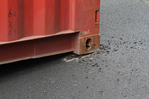 Fresh asphalt beat up after a 40 foot container hit the Napier Street railway bridge and fell onto the road