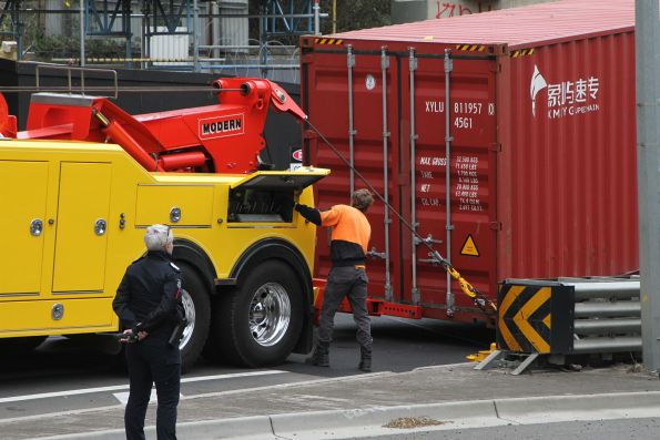 Heavy tow truck ready to drag off the 40 foot container off the truck stuck under the Napier Street bridge